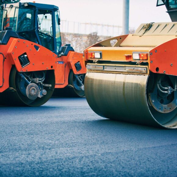 Close view on the road roller working on the new road construction site